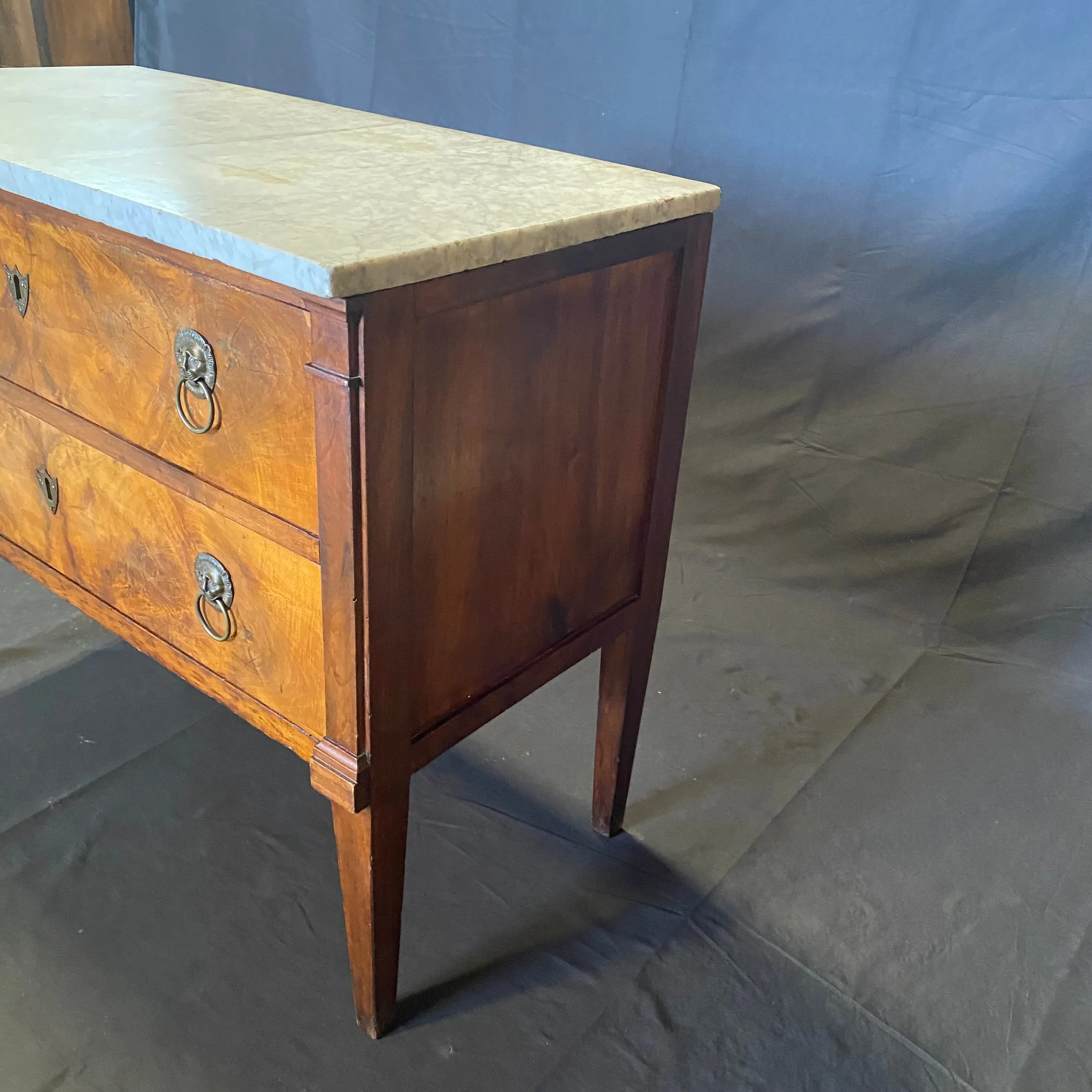 Early 19th Century French Continental Neoclassical Fruitwood Directoire Commode with Lion Pulls and Original Marble Top