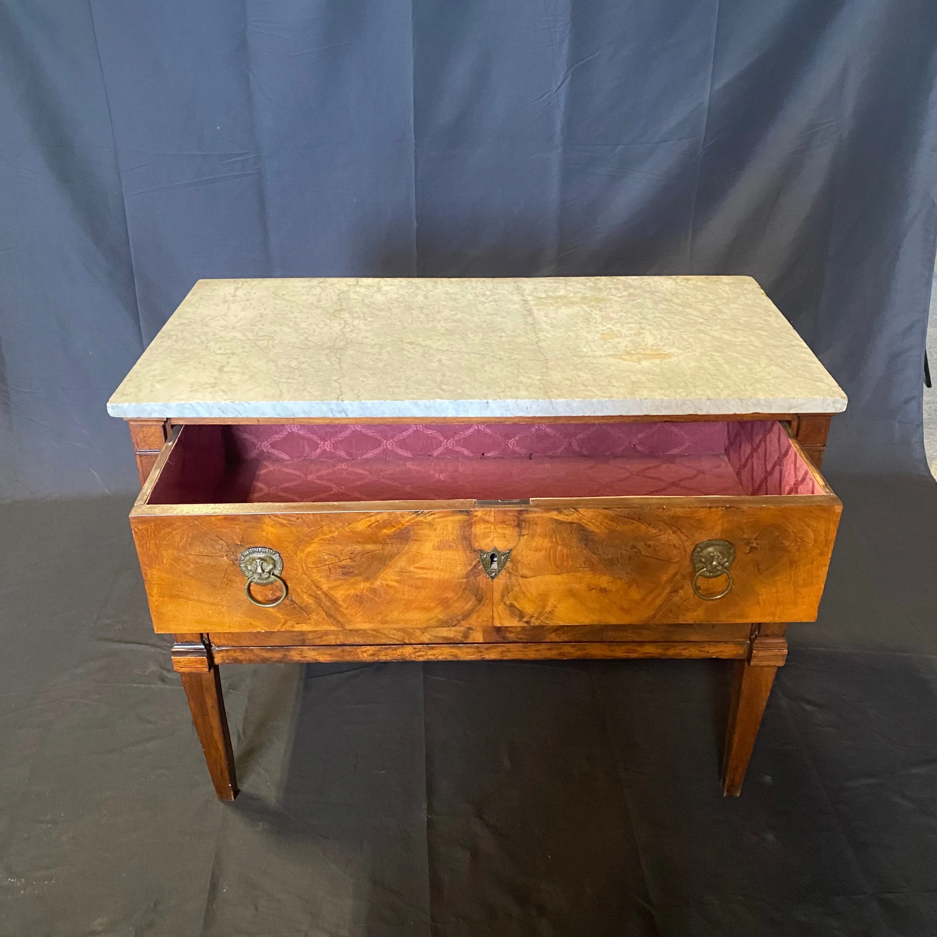 Early 19th Century French Continental Neoclassical Fruitwood Directoire Commode with Lion Pulls and Original Marble Top